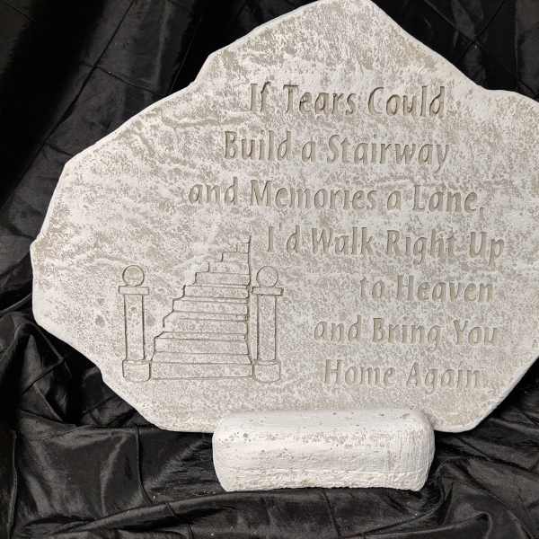 Memorial stone with engraved staircase and verse on a stand