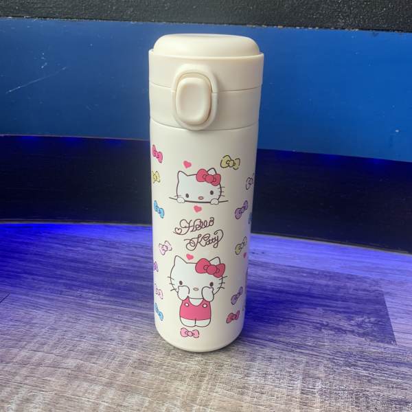 Hello Kitty travel tumbler with pink bow graphics