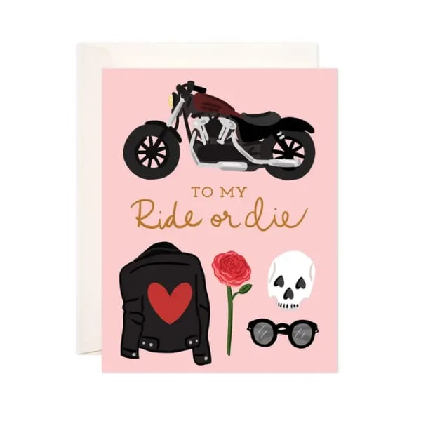 Pink card with a motorcycle, rose, skull, jacket, and sunglasses
