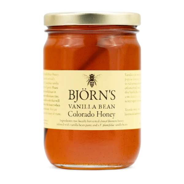 Jar of vanilla bean Colorado honey with a gold lid