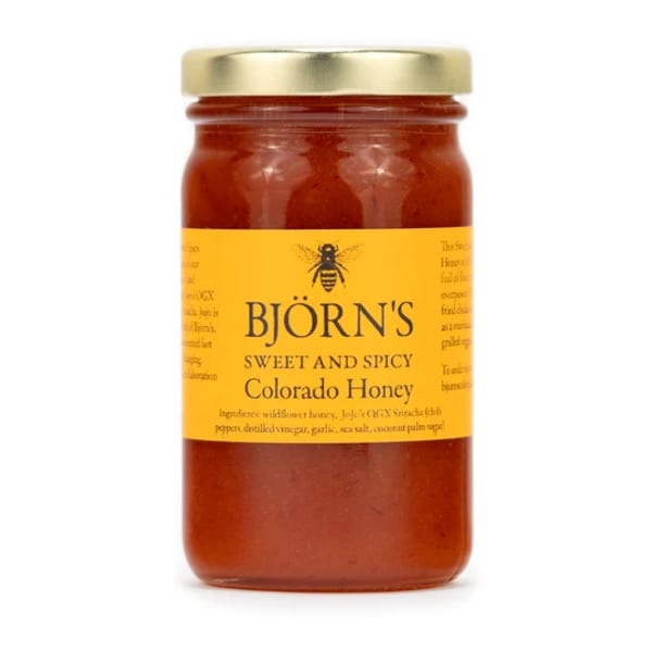 Jar of sweet and spicy Colorado honey with a gold lid