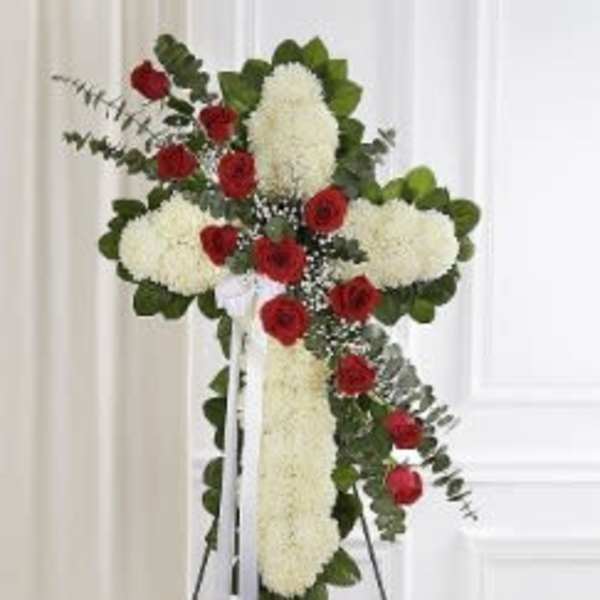 Standing floral cross with red roses and white flowers