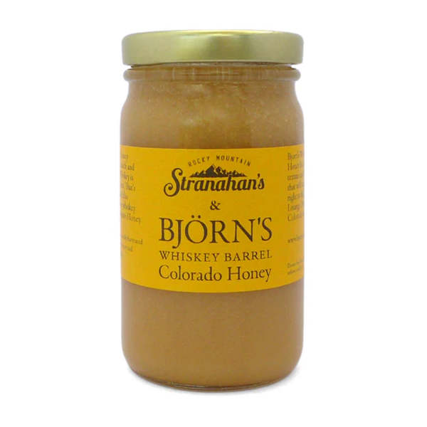 Jar of Colorado honey with a yellow label and gold lid