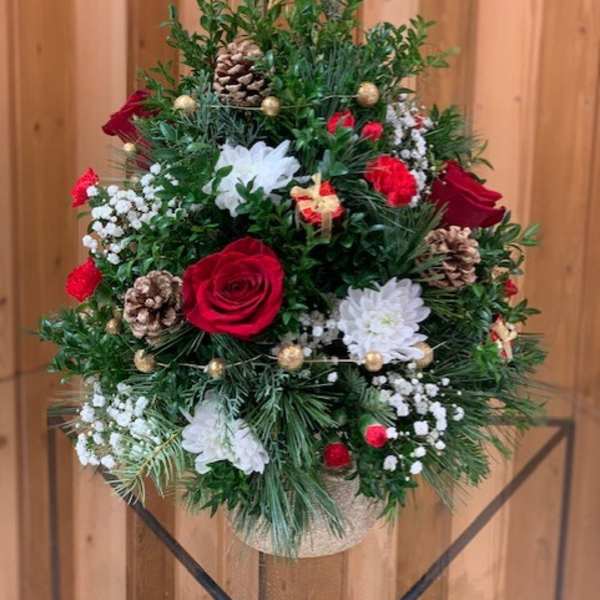 Christmas tree-shaped floral arrangement with red and white flowers