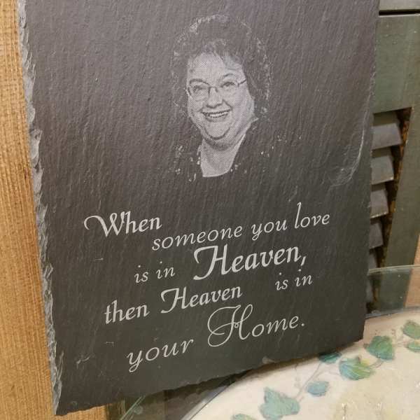 Slate memorial plaque with a portrait and sympathy quote