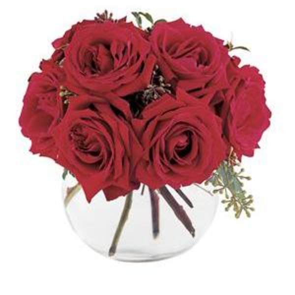 Red rose bouquet in a clear glass vase