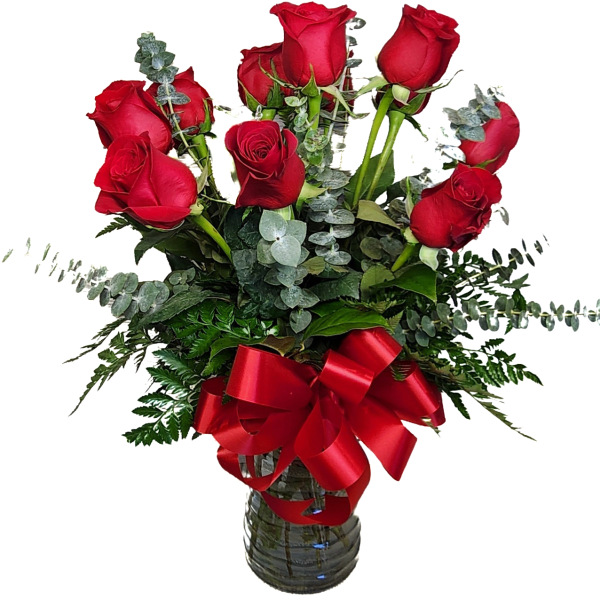 Red roses in a glass vase with a red ribbon bow