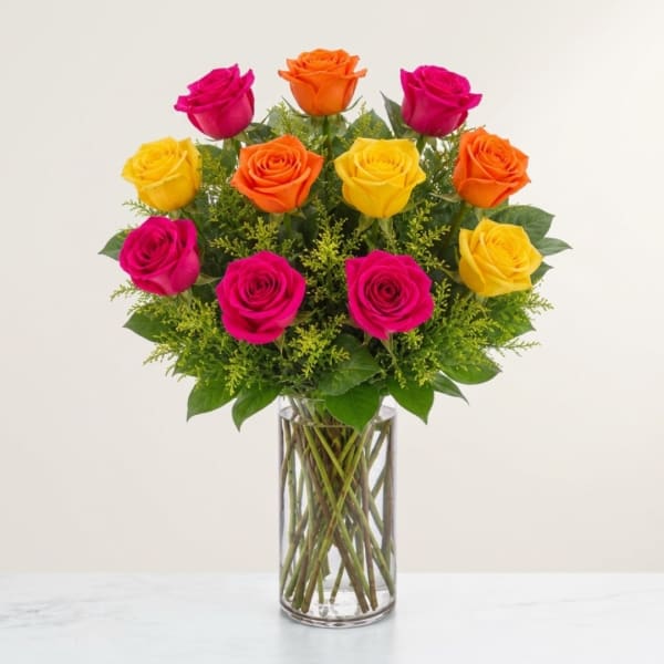 Colorful rose bouquet in a clear glass vase