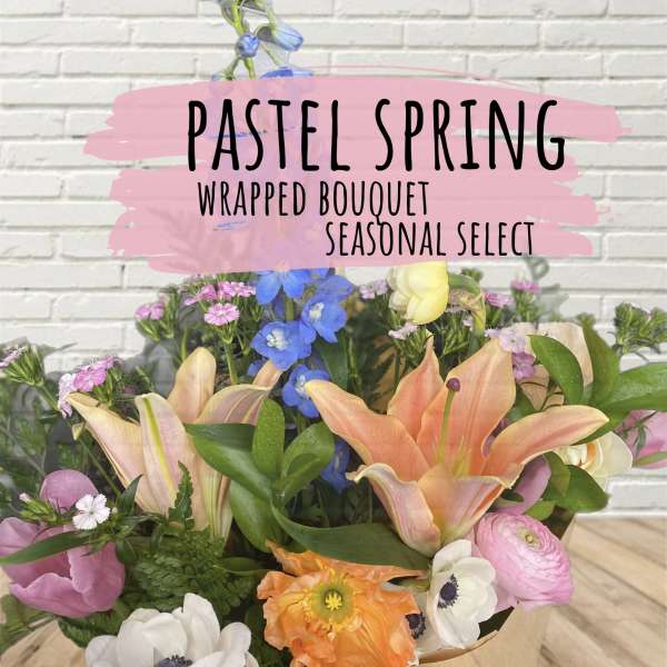 Wrapped bouquet with lilies, poppies, and mixed pastel flowers
