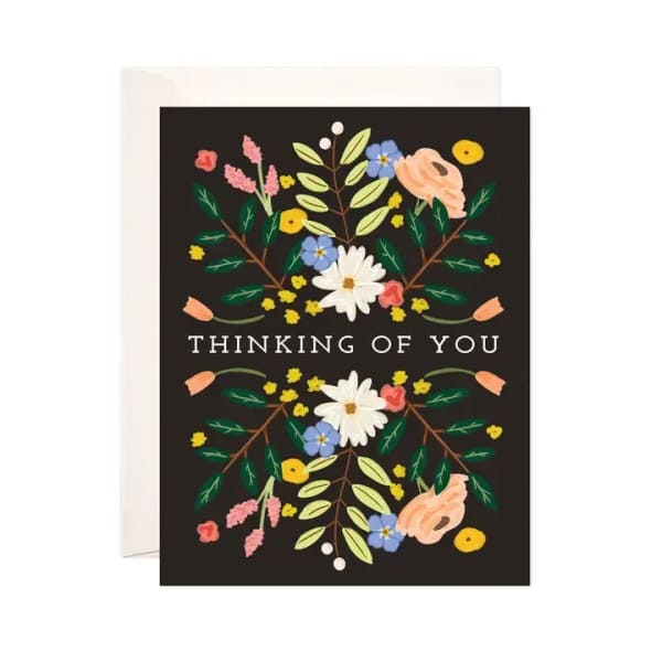 Thinking of You card with floral illustration on a black background