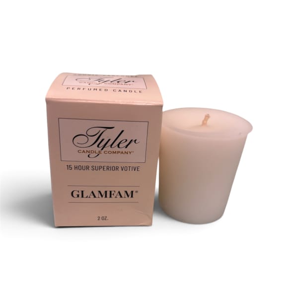 Pink boxed votive candle beside a matching candle cup