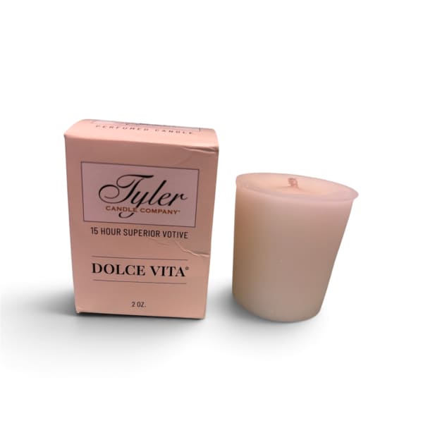 Pink boxed votive candle beside a matching candle