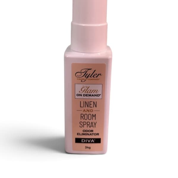 Pink linen and room spray bottle with a tall cap