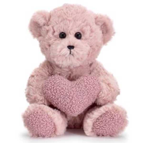 Pink teddy bear holding a heart