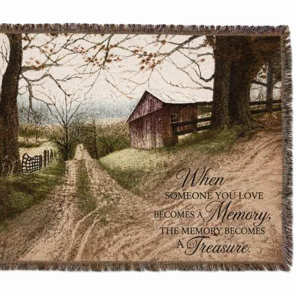 Fringed throw blanket with a rustic barn scene and memorial quote