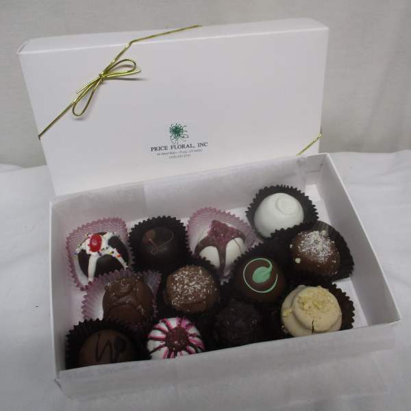 Box of assorted chocolate truffles in paper cups