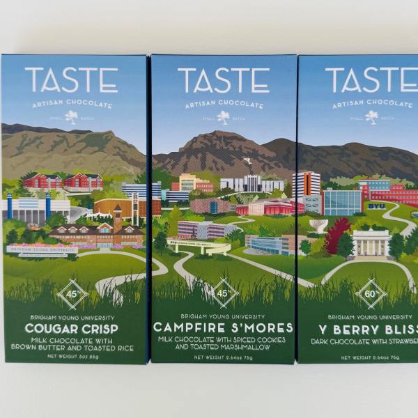 Three boxes of artisan chocolate with illustrated campus scenes