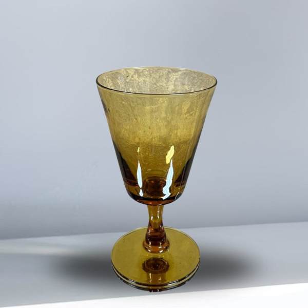 Amber glass goblet with a wide bowl and short stem