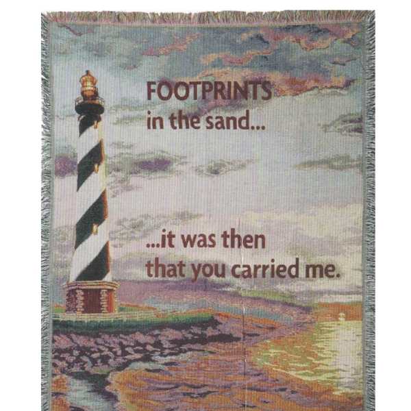 Printed blanket with a lighthouse and the words "Footprints in the sand"