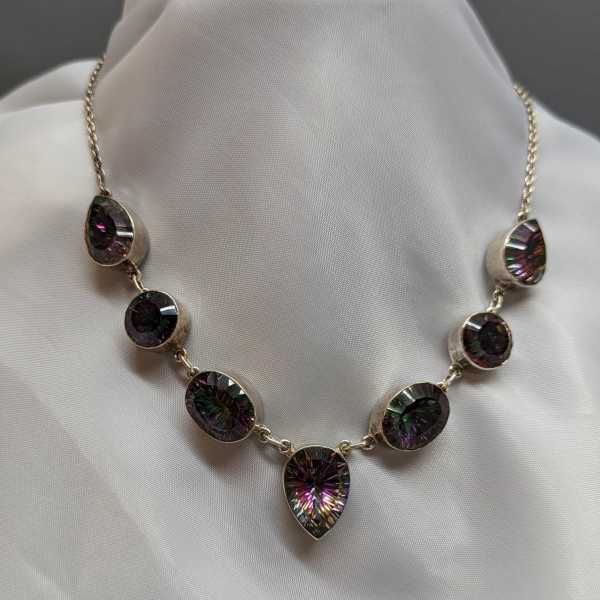 Faceted gemstone necklace on white fabric