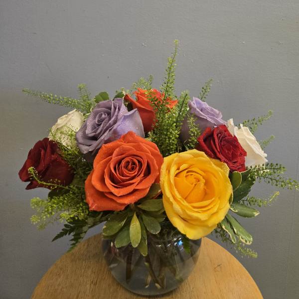 Colorful rose bouquet in a glass vase