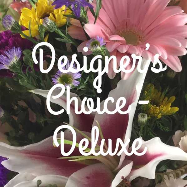 Mixed bouquet with pink lilies, gerbera daisies, and purple flowers
