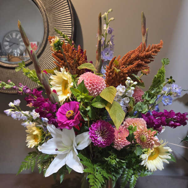 Colorful mixed flower arrangement in a glass vase