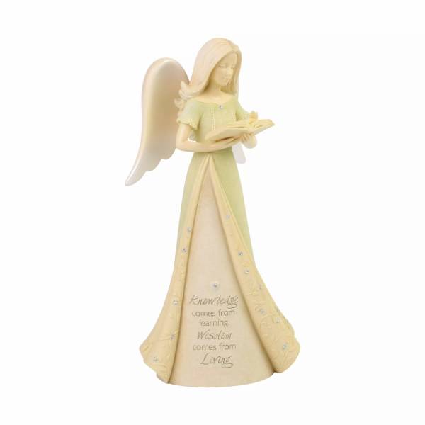 Angel figurine holding an open book with a quote on the dress