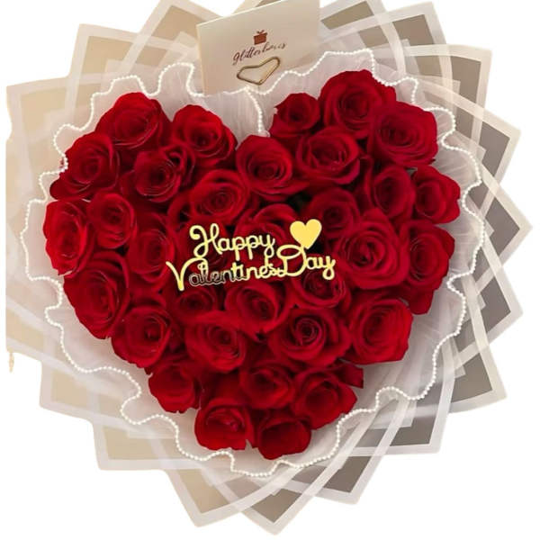 Heart-shaped bouquet of red roses with a Valentine's Day topper