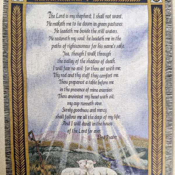 Decorative wall hanging with Psalm 23 text and two lambs in a pastoral scene
