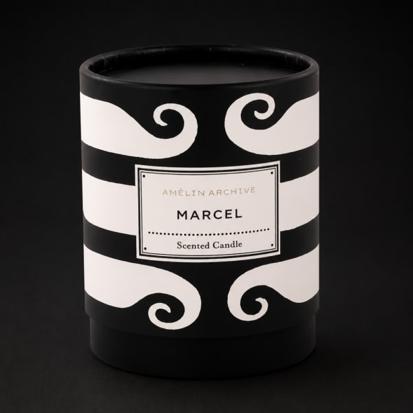 Black and white scented candle in a decorative container