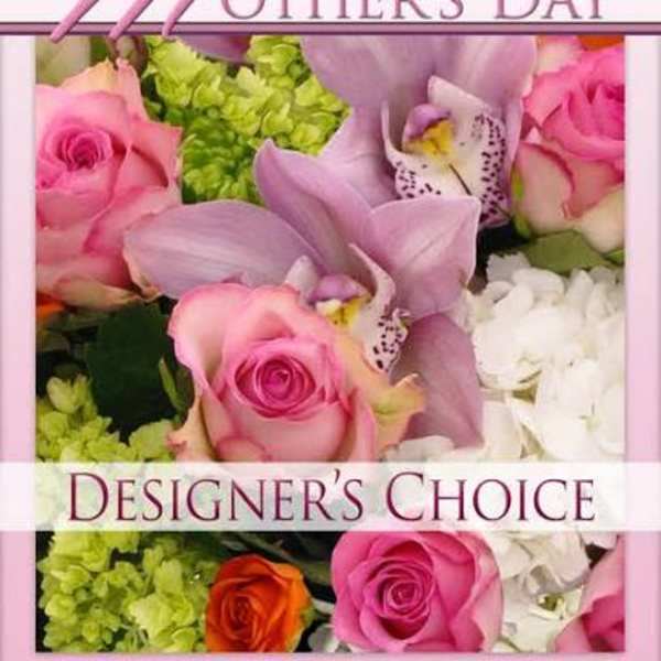 Mixed arrangement of pink roses, lavender orchids, and hydrangeas with a Mother’s Day designer’s choice label
