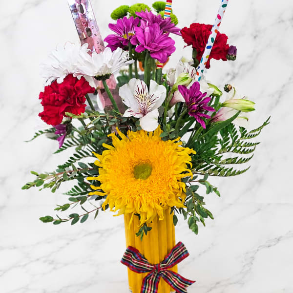 Colorful bouquet in a pencil vase with flowers and pencils