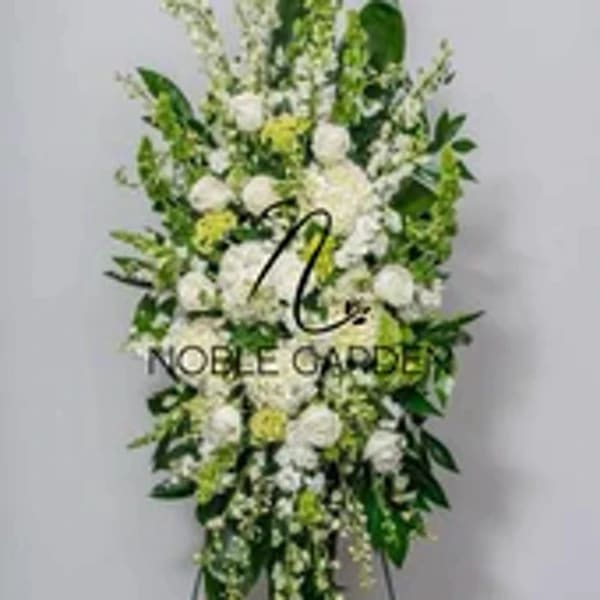 Tall white and green standing floral spray with mixed blooms