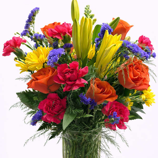 Colorful mixed bouquet in a clear glass vase