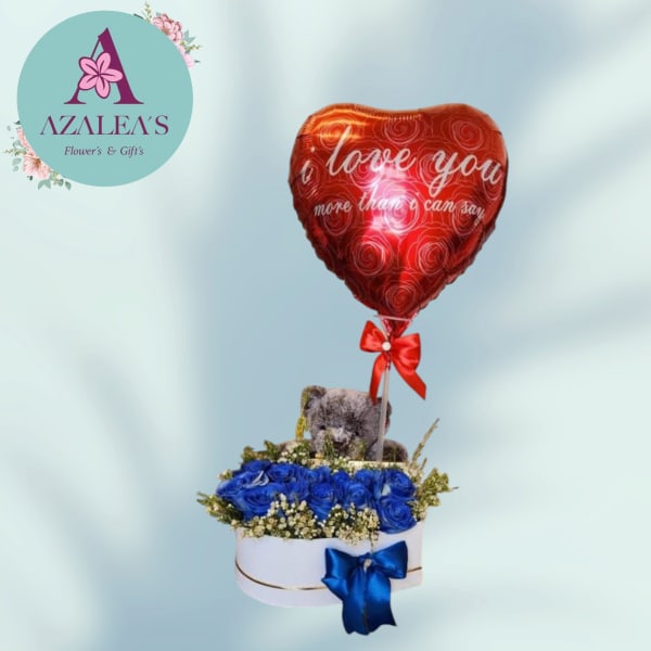 Blue rose arrangement with a teddy bear and red heart balloon