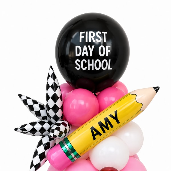 Balloon arrangement with a black "First Day of School" balloon and a yellow pencil balloon
