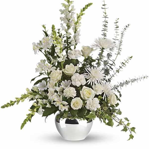 White floral arrangement in a silver vase with roses and tall spiky blooms