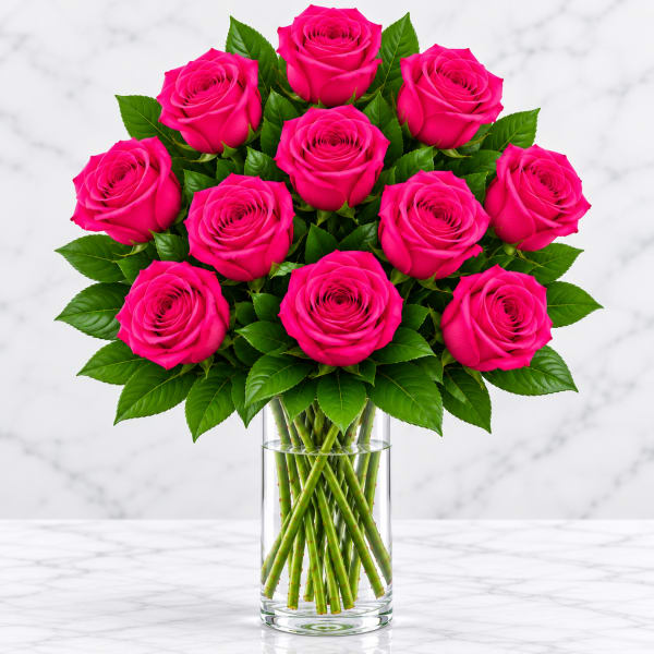 Bouquet of hot pink roses in a clear glass vase