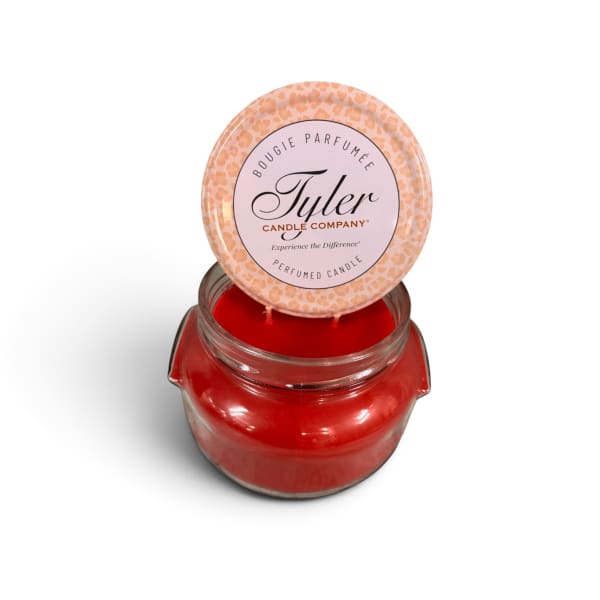 Red scented candle in a glass jar with a printed lid