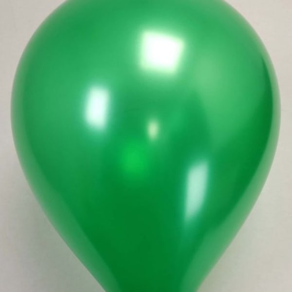 Single green balloon on a plain background