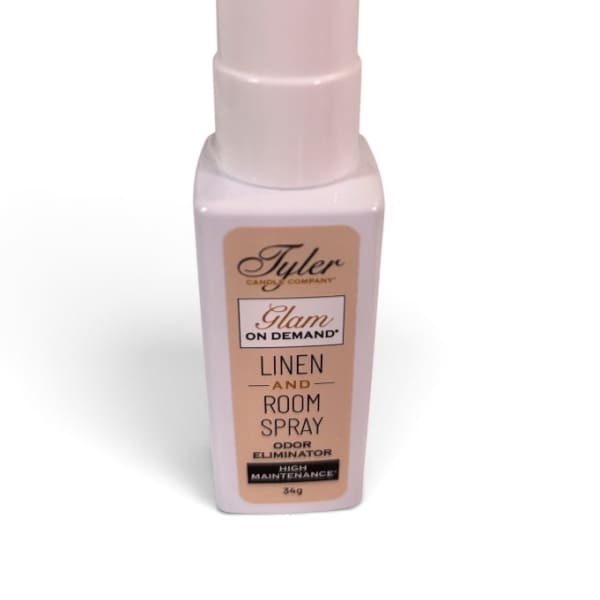 Pink room spray bottle with a tall cap