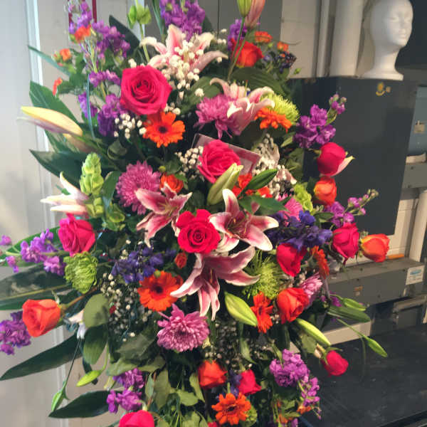 Large mixed bouquet with pink roses, lilies, and purple flowers
