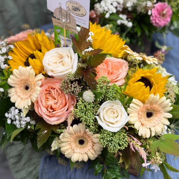 Bouquet with sunflowers, peach and white roses, and cream gerbera daisies