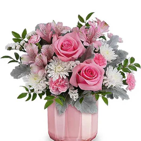 Pink roses and white daisies in a pink glass vase