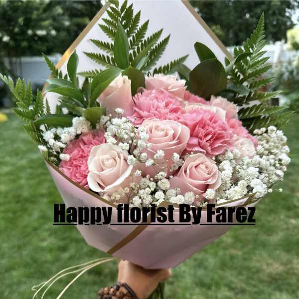 Pink rose and carnation bouquet with baby's breath in pink wrap