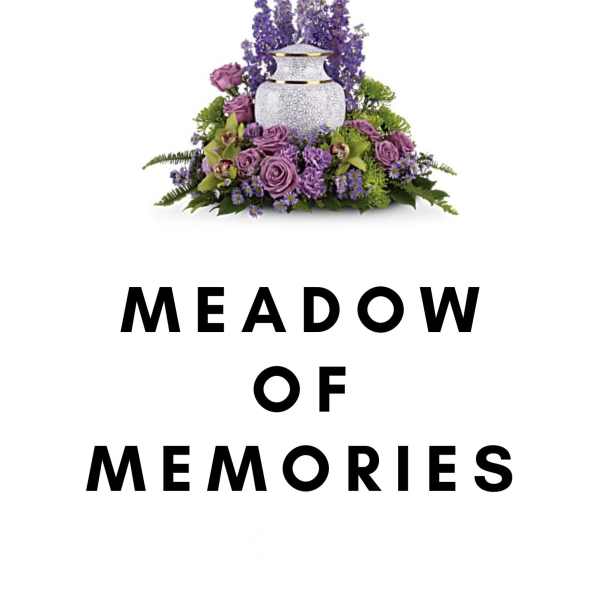 Purple floral arrangement around a white urn with "Meadow of Memories" text below