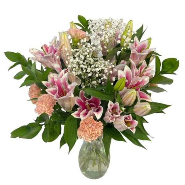 Pink lilies and carnations in a glass vase
