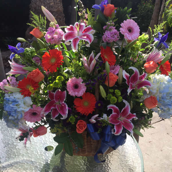 Large mixed flower basket with lilies, gerberas, roses, and hydrangeas