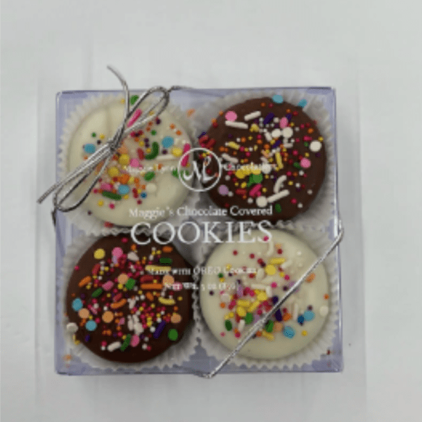 Box of four chocolate-covered cookies with colorful sprinkles
